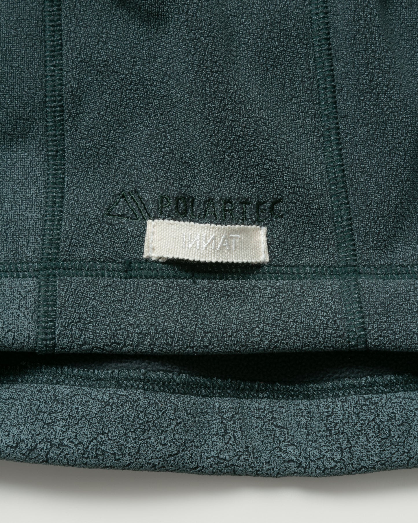 INNAT "PIGMENT PRINT WASH POLARTEC STORM HOODIE" / インアット "製品染めポーラテックフーディー"